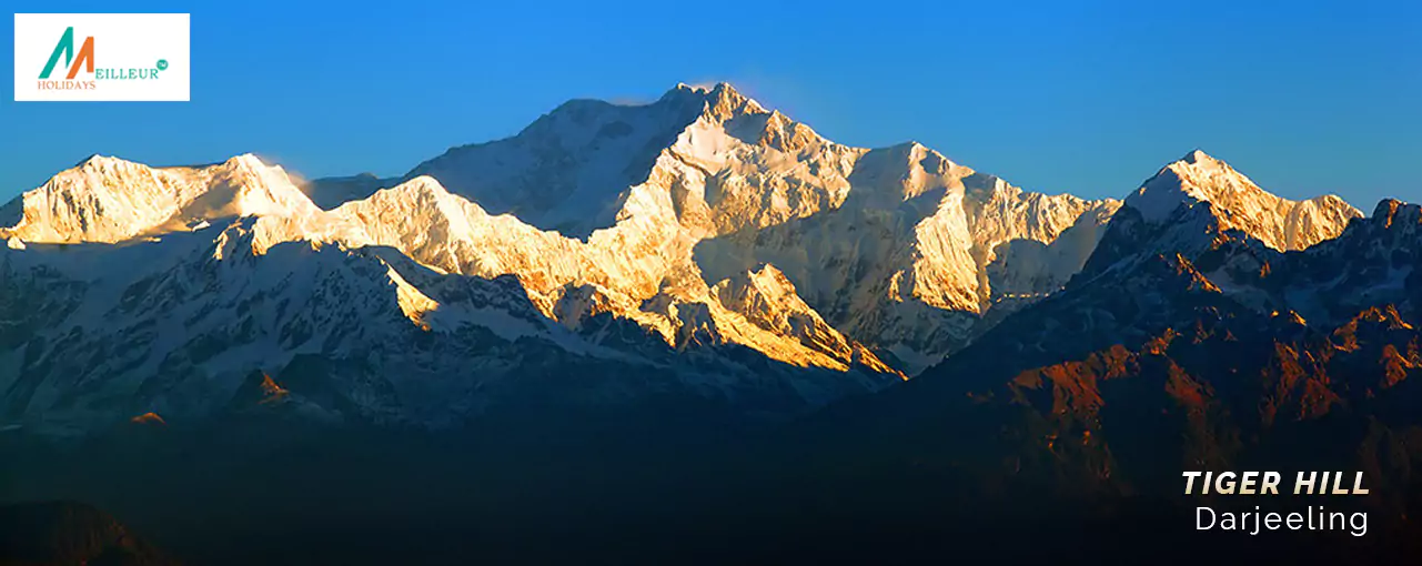 Experience the magic of sunrise over Himalayan peaks on your Gangtok Darjeeling Tour Package.