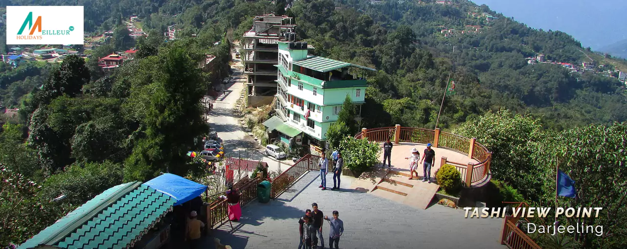 View of Tashi View Point in Gangtok with people observing the scenery, part of the Gangtok Darjeeling Tour Package.