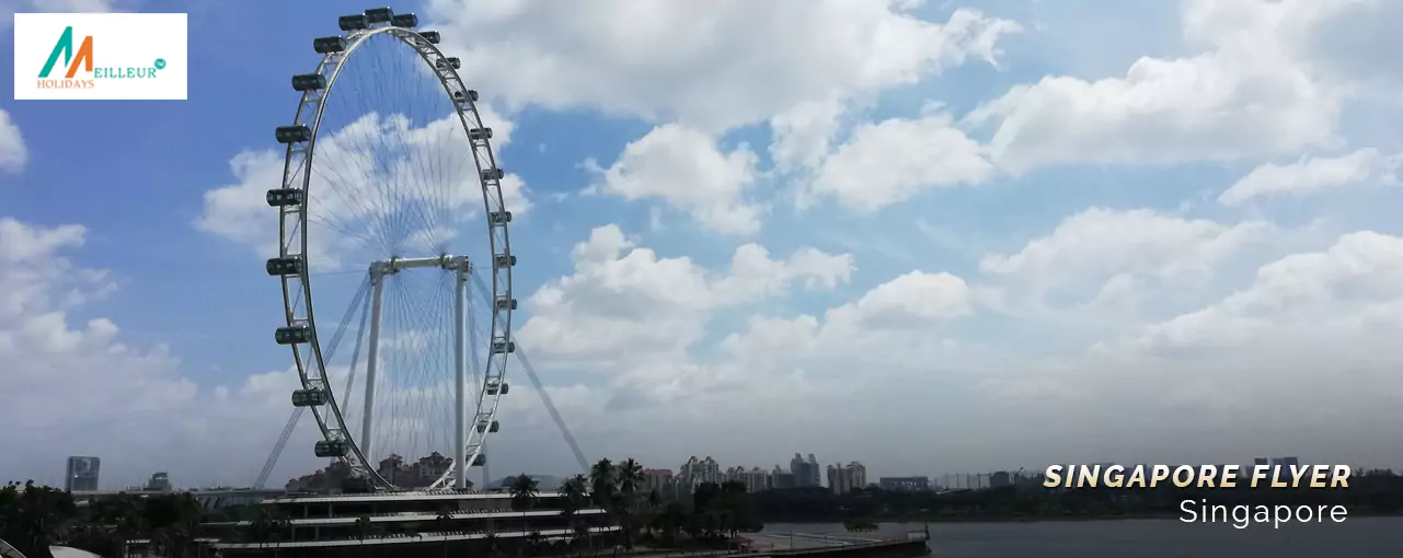 The Singapore Flyer against a cloudy sky, part of the Singapore Malaysia Tour Package.
