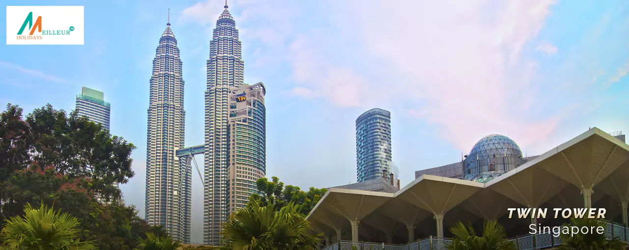 Panoramic view of Petronas Twin Towers in Kuala Lumpur, Malaysia, part of the Singapore Malaysia Tour Package.